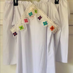 white, strapless blouse, with flower design